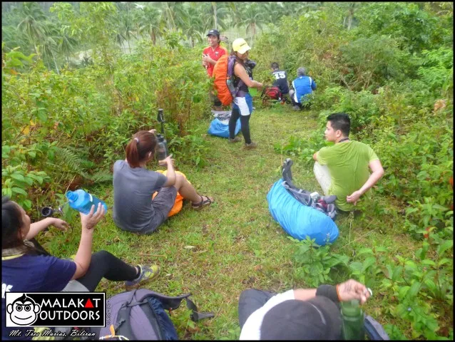 Our first rest of the climb after our ordeal through the muddy section.